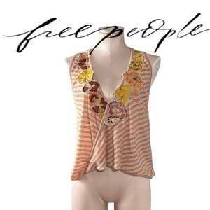 Free People top with flower “patches”. Size S
